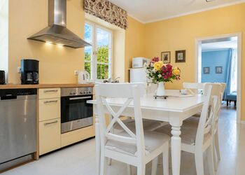 Photo: PapadoXX-Fotografie Dirk Poxdoerfer – Kaminwohnung holiday flat kitchen with dining area