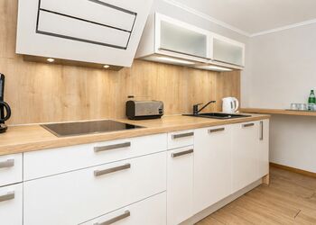 Photo: PapadoXX-Fotografie Dirk Poxdoerfer – Haus Mai holiday home modern kitchen