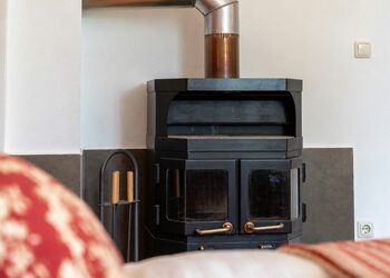 Photo: PapadoXX-Fotografie Dirk Poxdoerfer – Kaminwohnung holiday flat living room with a fireplace