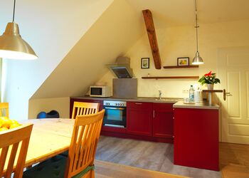 Kitchen with dining table apartment Kutscherwohnung